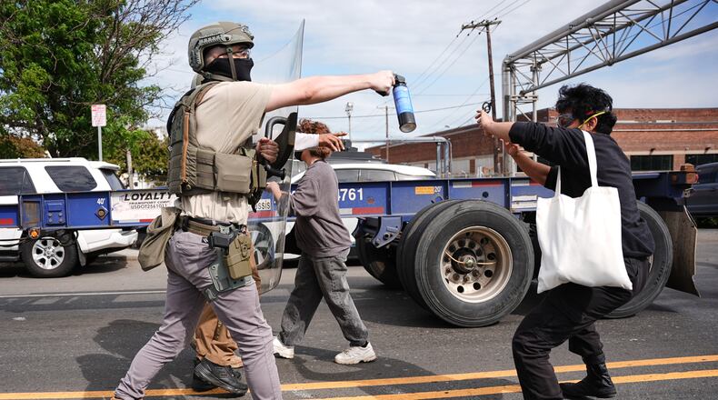 Federal immigration officers confront protesters outside the Delaney Hall detention center Thursday, May 28, 2026, in Newark, N.J. (AP Photo/Angelina Katsanis)