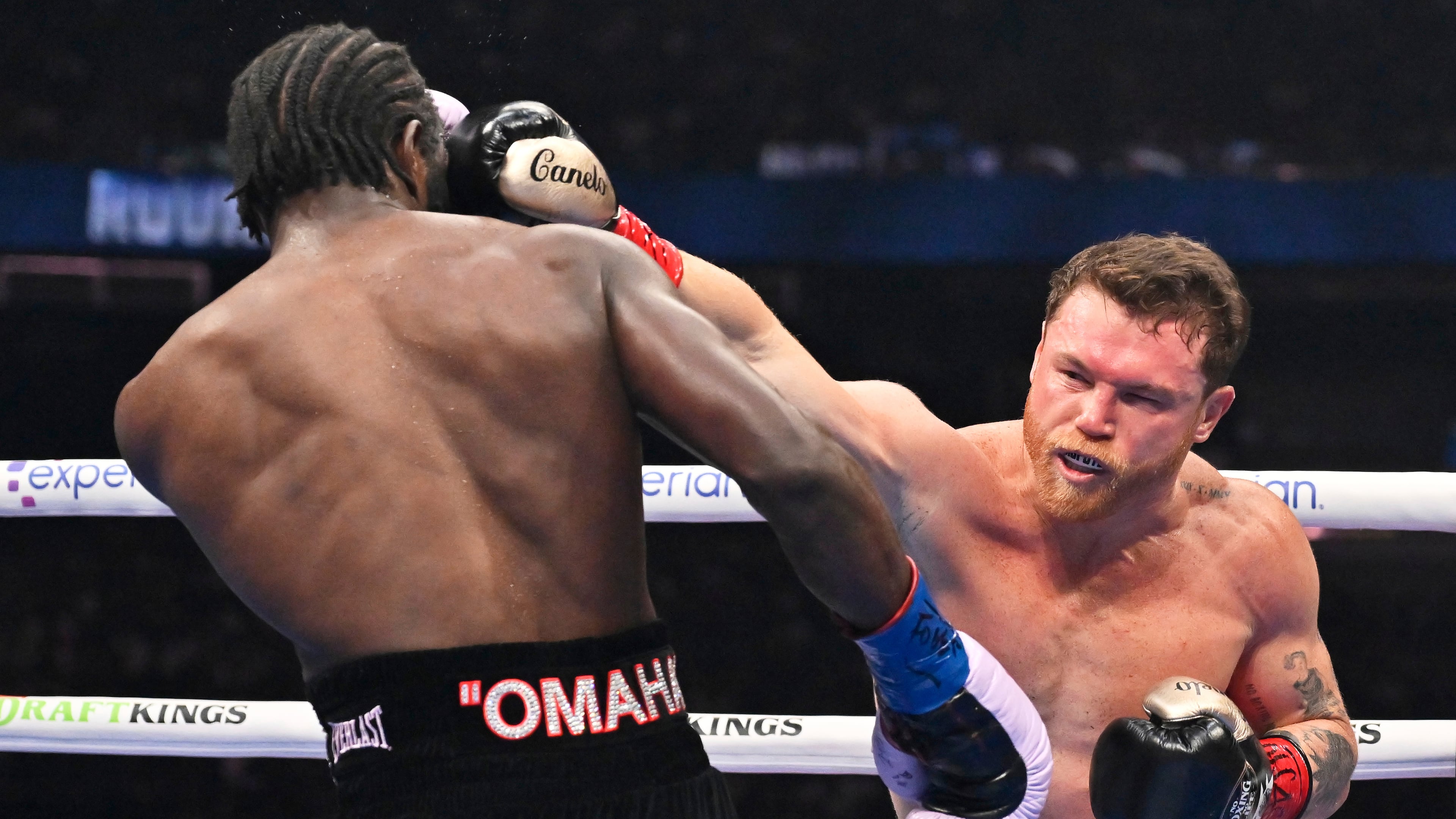 Canelo Alvarez, right, punches Terence Crawford during an undisputed super middleweight championship boxing match in Las Vegas, Saturday, Sept. 13, 2025. (AP Photo/David Becker)