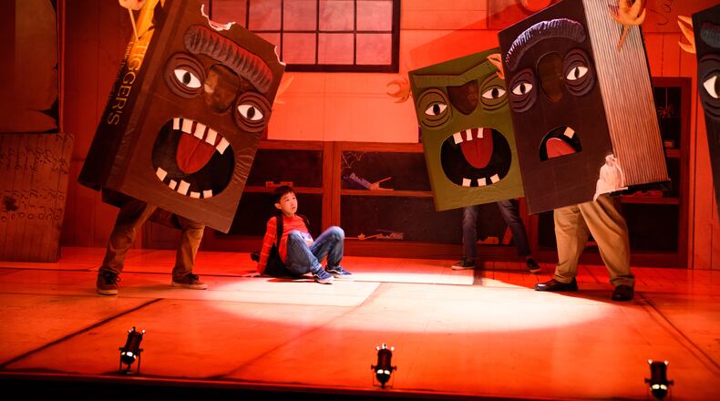 In one of the most engaging song and dance numbers in the Alliance Theatre's world-premiere musical adaptation of Oliver Jeffers' celebrated children's book "The Incredible Book Eating Boy," the books decide to fight back. (Photos by Greg Mooney.)