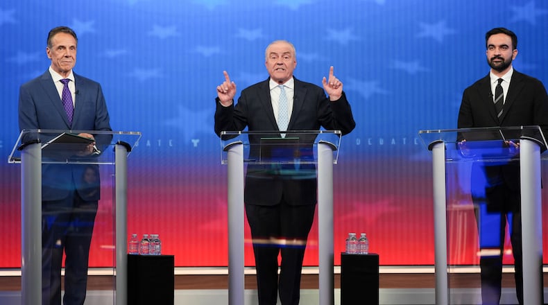 Republican candidate Curtis Sliwa, center, speaks during a mayoral debate with independent candidate former New York Gov. Andrew Cuomo, left, and Democratic candidate Zohran Mamdani, Thursday, Oct. 16, 2025, in New York. (AP Photo/Angelina Katsanis, Pool)