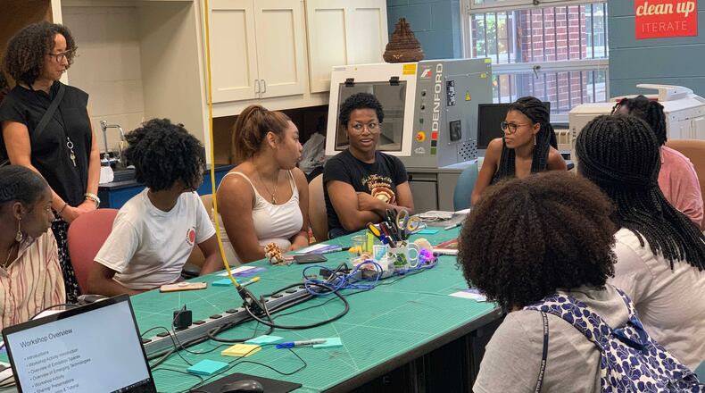 Spelman College students discuss a classroom assignment. The Atlanta college has partnered with, Braven, a nonprofit company, to prepare sophomore students for careers or graduate school. Photo Credit: Spelman College.