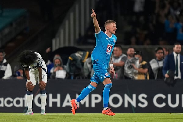 Mateusz Bogusz of Mexico's Cruz Azul celebrates scoring his side's 4th goal against Canada's Vancouver Whitecaps during the CONCACAF Champions Cup final soccer match in Mexico City, Sunday, June 1, 2025. (AP Photo/Fernando Llano)