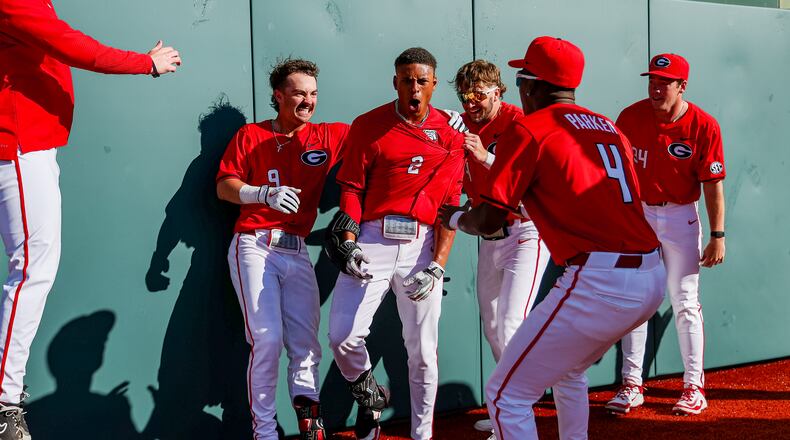 Georgia baseball infielder Ryan Black (2) celebrates with teammates in front of the center-field wall after hitting a two-run homer to walk off Florida Gulf Coast 4-3 on Sunday at Foley Field in Athens, Georgia. (Conor Dillon/UGAAA)