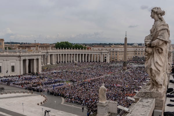 FILE - A crowd gathers in St. Peter's Square at the Vatican, where newly elected Pope Leo XIV will deliver a blessing from the central balcony of St. Peter's Basilica on Sunday, May 11, 2025. (AP Photo/Domenico Stinellis, File)