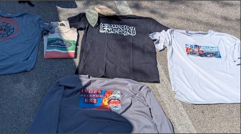 This photo provided by U.S. Attorney's Office shows clothing displaying antisemitic, anti-Israel, and extremist symbols that were found in former Navy SEAL Seal Gregory Vandenberg vehicle by authorities. (U.S. Attorney's Office via AP)