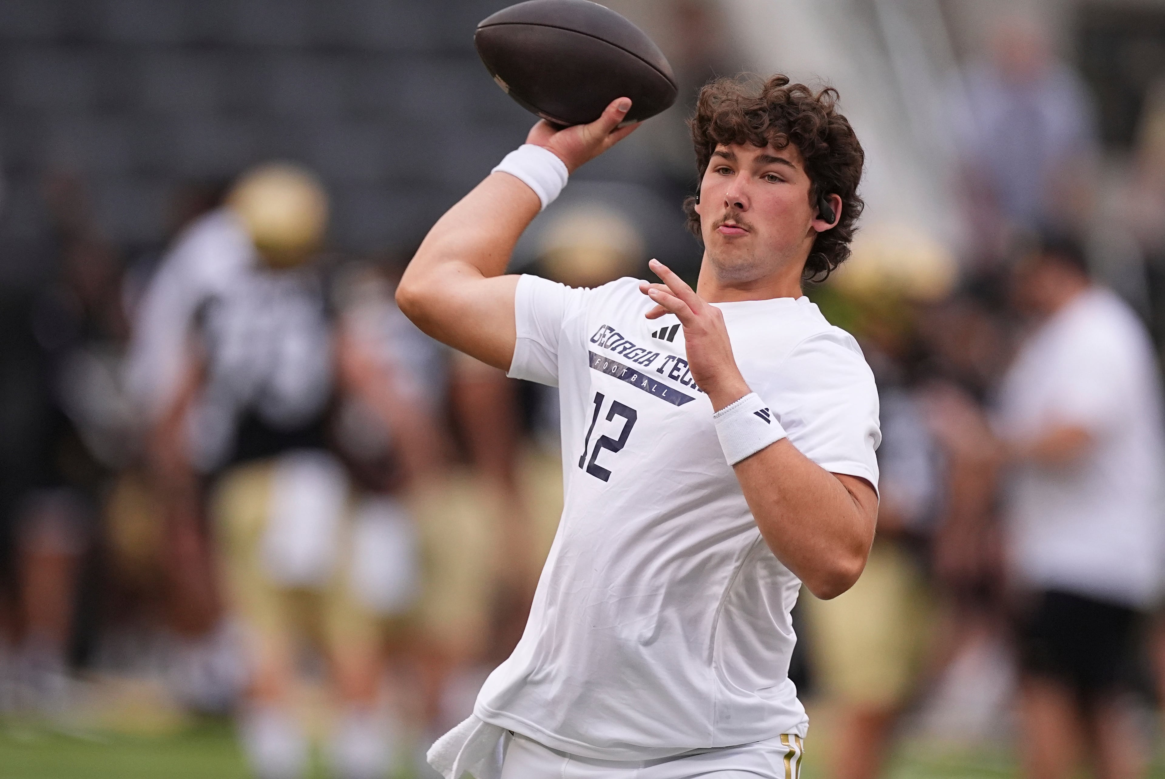 Georgia Tech quarterback Aaron Philo warms up before an NCAA college football game against Colorado, Friday, Aug. 29, 2025, in Boulder, Colo. (AP Photo/David Zalubowski)