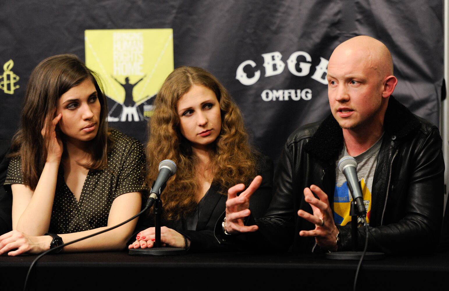 Nadezhda "Nadya" Tolokonnikova and Maria "Masha" Alekhina of Pussy Riot, and musician Isaac Slade from The Fray