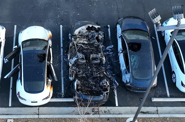 Police are investigating after several vehicles were set on fire at a Tesla service center, Tuesday, March 18, 2025, in Las Vegas. (Bizuayehu Tesfaye/Las Vegas Review-Journal via AP)