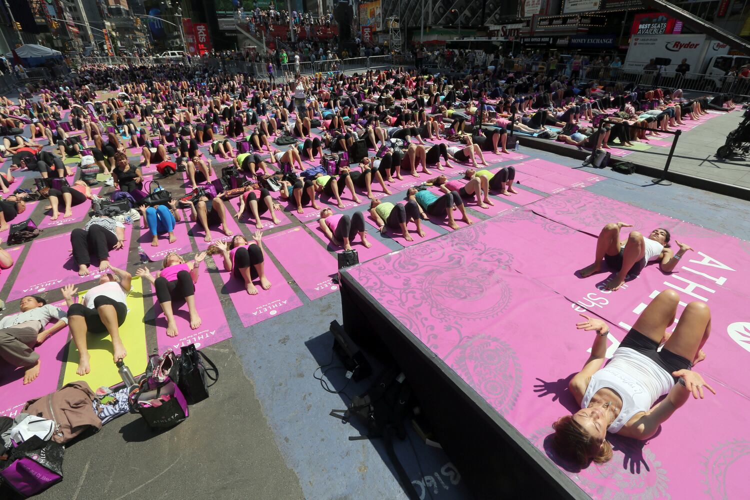 Enthusiasts perform yoga in Times Square to mark summer solstice, June 21, 2013