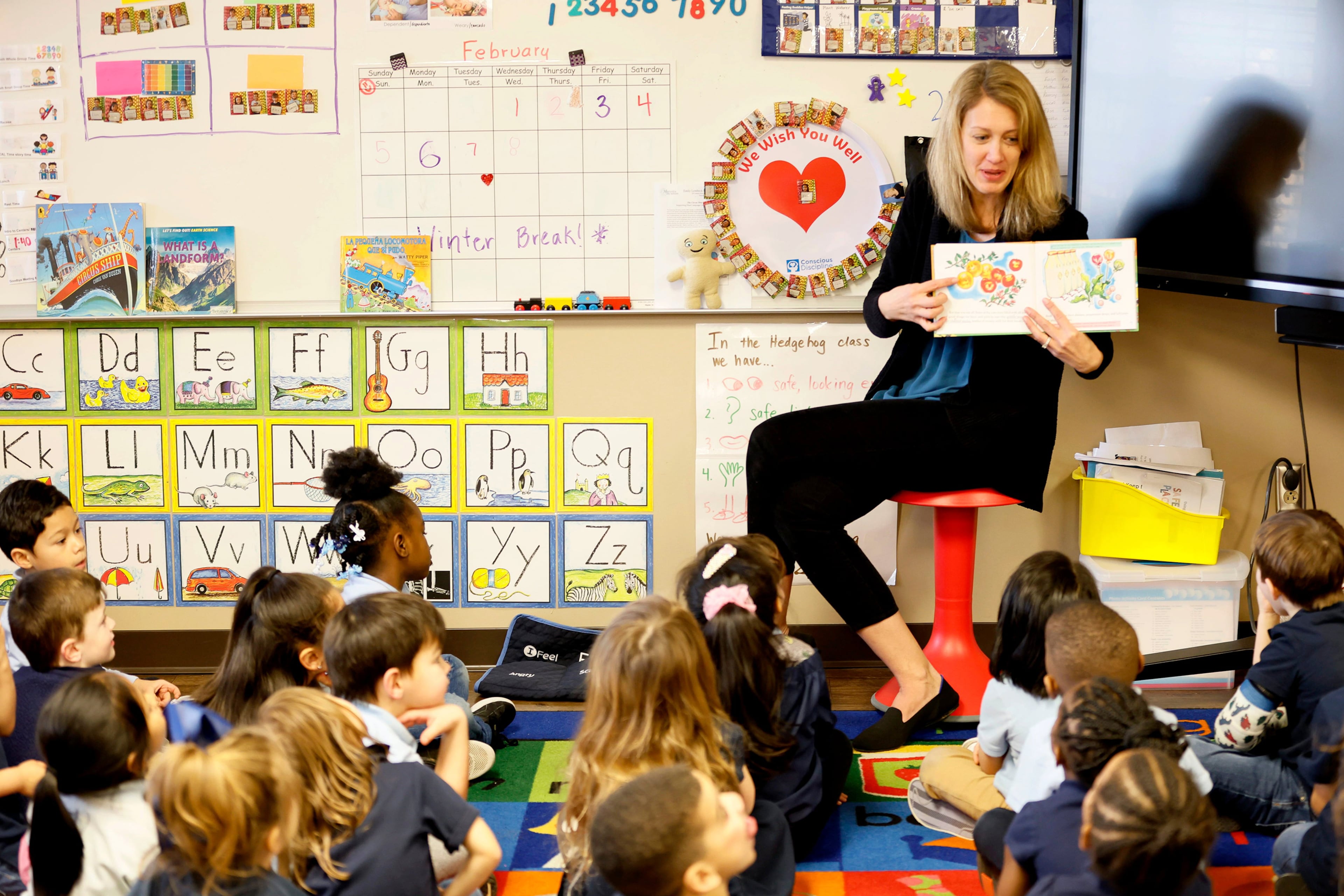 Pre-k Teacher Tricia Fox works with students at the Head Start program at the Emely Lemback Learning Center in Marietta. (Miguel Martinez/AJC)