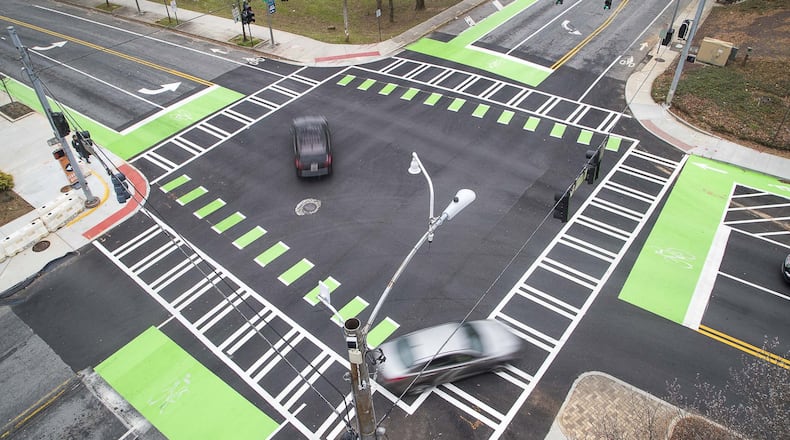 The intersection of Commerce Drive and West Trinity Place in downtown Decatur, Thursday, January 23, 2020. The city renovated the sidewalks adding enough space for a bicycle lane in addition to foot traffic. (ALYSSA POINTER/ALYSSA.POINTER@AJC.COM)