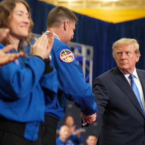 President Donald Trump, from right, shakes the hand of Artemis II crew member Jeremy Hansen after presenting him the Congressional Space Medal of Honor as fellow recipient Christina Koch applauds, Friday, Aug. 28, 2026, at Johnson Space Center in Houston. (AP Photo/Mark Schiefelbein)
