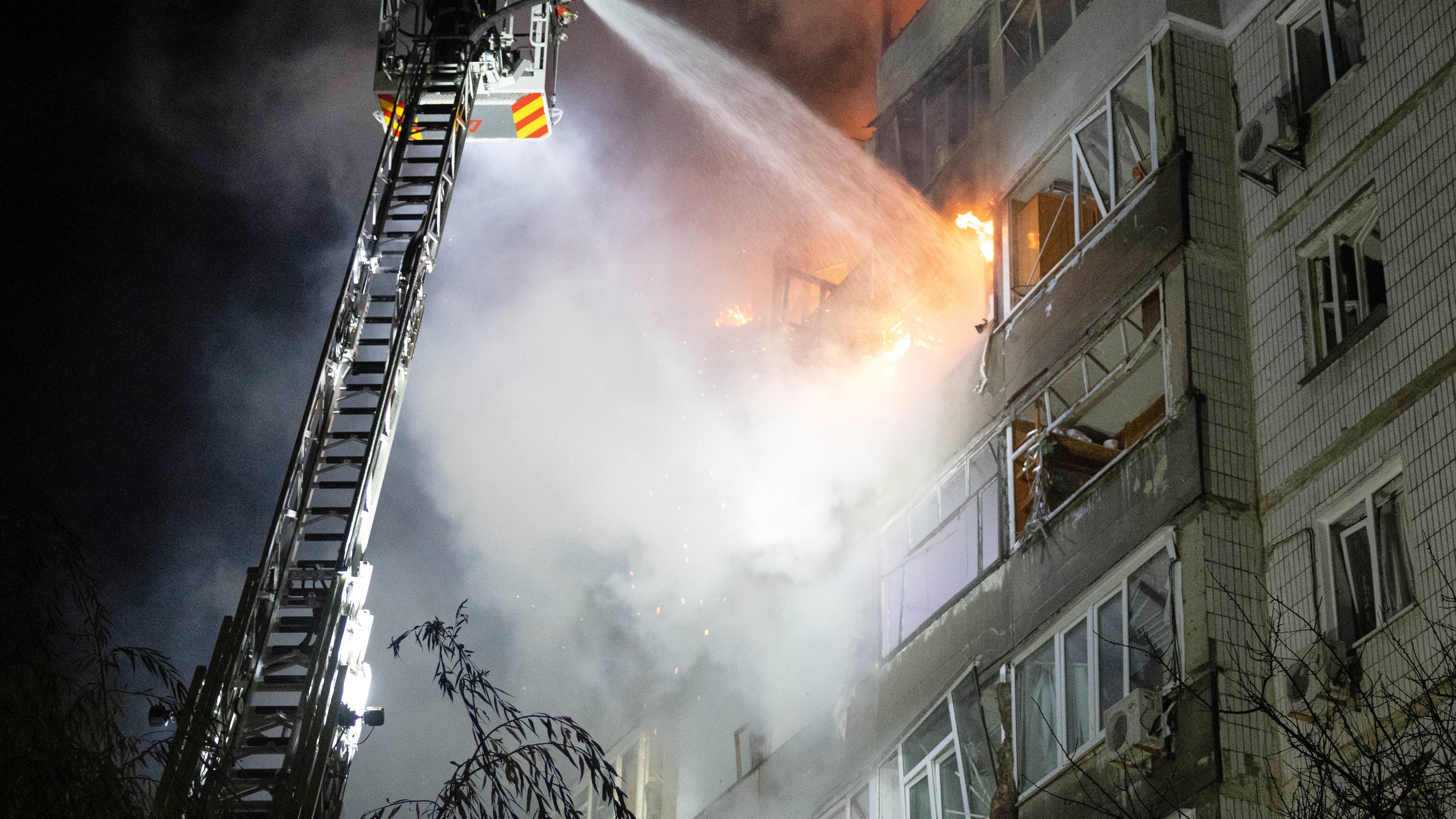 In this photo provided by the Ukrainian Emergency Service, emergency personnel work to extinguish a fire in Sumy, Ukraine, on Friday, Oct. 31, 2025, following Russian drone attacks. (Ukrainian Emergency Service via AP)