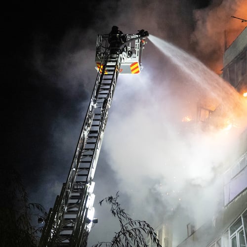 In this photo provided by the Ukrainian Emergency Service, emergency personnel work to extinguish a fire in Sumy, Ukraine, on Friday, Oct. 31, 2025, following Russian drone attacks. (Ukrainian Emergency Service via AP)