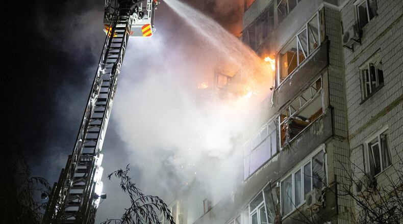 In this photo provided by the Ukrainian Emergency Service, emergency personnel work to extinguish a fire in Sumy, Ukraine, on Friday, Oct. 31, 2025, following Russian drone attacks. (Ukrainian Emergency Service via AP)