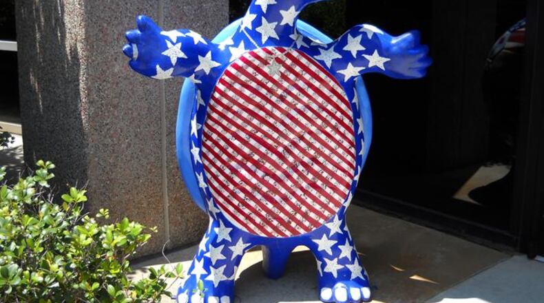 A turtle guards the entrance to the Sandy Springs City Council chambers. The Council recently approved acquiring land for the reconstruction of the intersection of Roswell Road and Glenridge Drive. AJC FILE