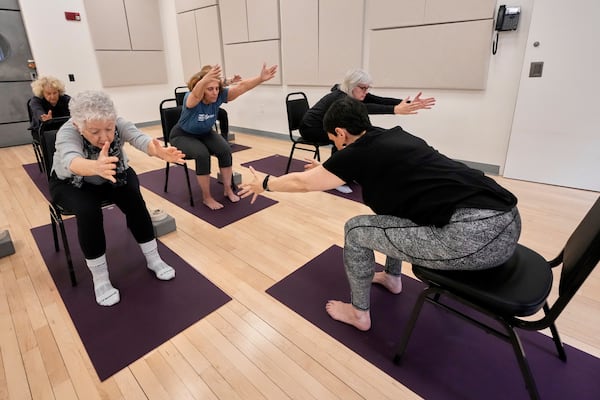 Whitney Chapman, right, conducts a chair yoga class at the Marlene Meyerson JCC Manhattan, in New York, March 28, 2025. (AP Photo/Richard Drew)