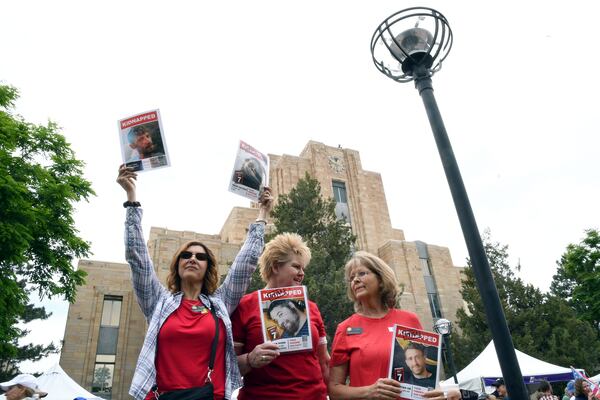 Colorado State Rep. Lori Garcia Sander, left, state GOP Chair Brita Horn, center, and state Sen. Barbara Kirkmeyer, right, show support for the hostages held in Gaza during the Boulder Jewish Festival in Boulder, Colo., on Sunday, June 8, 2025.(AP Photo/Thomas Peipert)