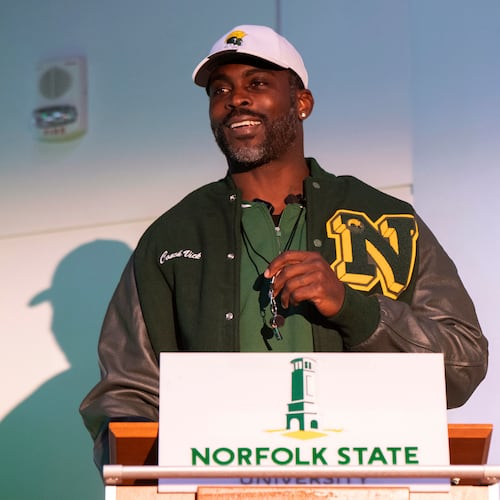 Michael Vick holds a whistle around his neck after he is introduced as the head coach of the Norfolk State football team during a press conference on Monday, Dec. 23, 2024. Vick earned his first Division I win when his team beat Hampton over the weekend. (Mike Caudill/AP)