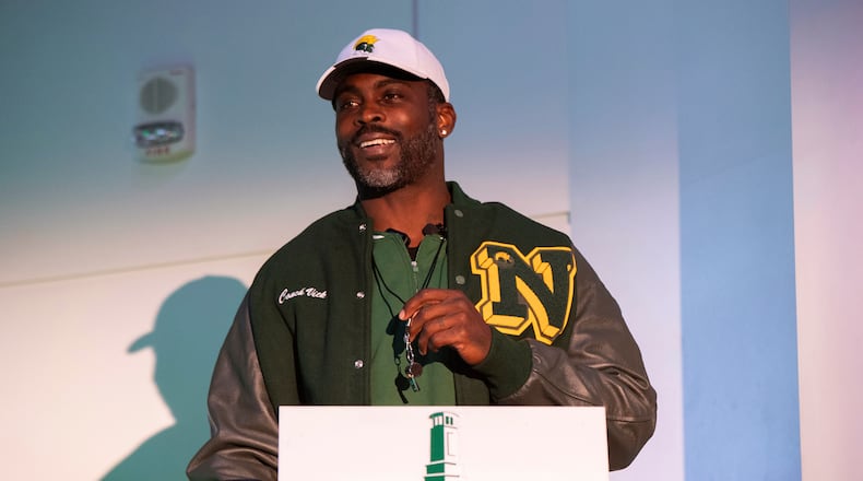 Michael Vick holds a whistle around his neck after he is introduced as the head coach of the Norfolk State football team during a press conference on Monday, Dec. 23, 2024. Vick earned his first Division I win when his team beat Hampton over the weekend. (Mike Caudill/AP)