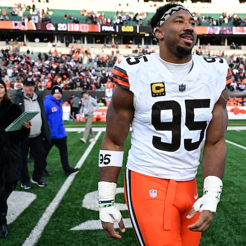 FILE - Cleveland Browns defensive end Myles Garrett celebrates with fans after an NFL football game against the Cincinnati Bengals in Cincinnati, Jan. 4, 2026. (AP Photo/David Dermer, File)