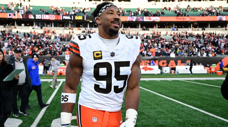 FILE - Cleveland Browns defensive end Myles Garrett celebrates with fans after an NFL football game against the Cincinnati Bengals in Cincinnati, Jan. 4, 2026. (AP Photo/David Dermer, File)