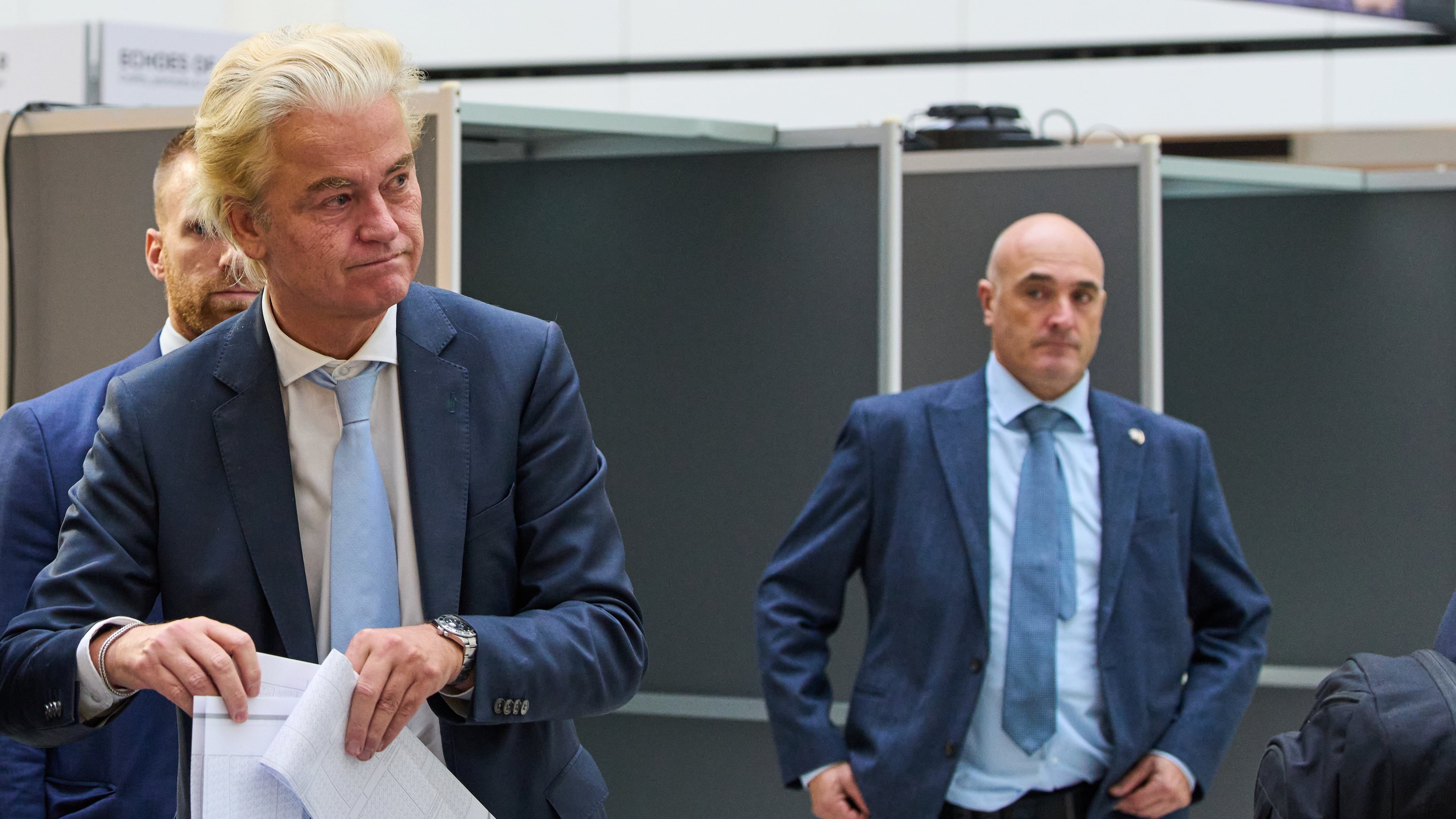 Far-right anti Islam lawmaker Geert Wilders, second left, casts his vote at a polling station during general elections in The Hague, Netherlands, Wednesday, Oct. 29, 2025. (AP Photo/Peter Dejong)