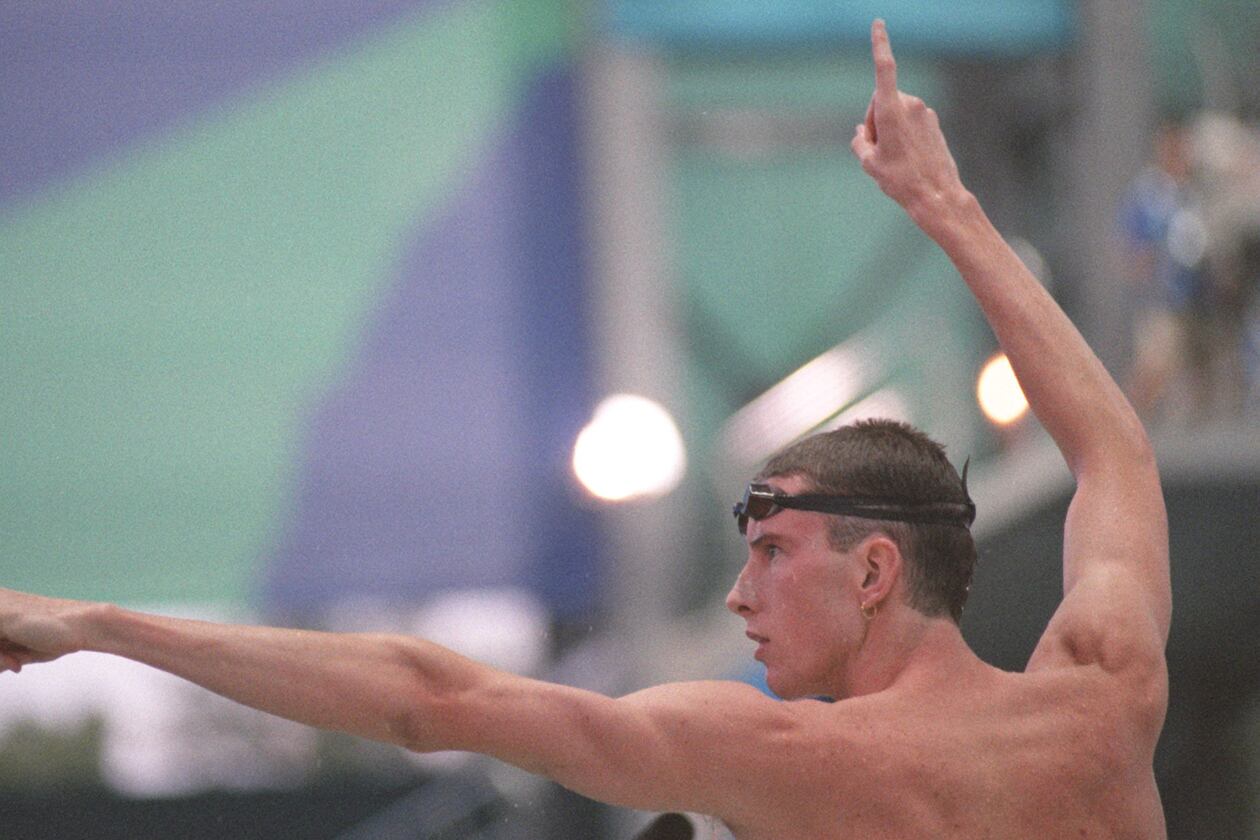 American swimmer Tom Dolan celebrates his gold medal win in the 400m medley, Sunday night, July 21, 1996, at the Georgia Tech Aquatics Center during the 1996 Summer Olympic Games in Atlanta,. (David Tulis/AJC)