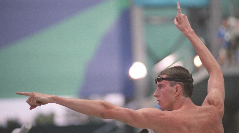 American swimmer Tom Dolan celebrates his gold medal win in the 400m medley, Sunday night, July 21, 1996, at the Georgia Tech Aquatics Center during the 1996 Summer Olympic Games in Atlanta,. (David Tulis/AJC)