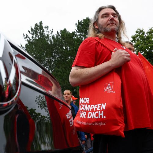 Employees of carmaker Volkswagen AG and IG Metall union members rally on the grounds of the Volkswagen headquarters on the day of the supervisory board meeting, in Wolfsburg, Germany, Thursday, July 9, 2026. (Lisi Niesner/Pool Photo via AP)
