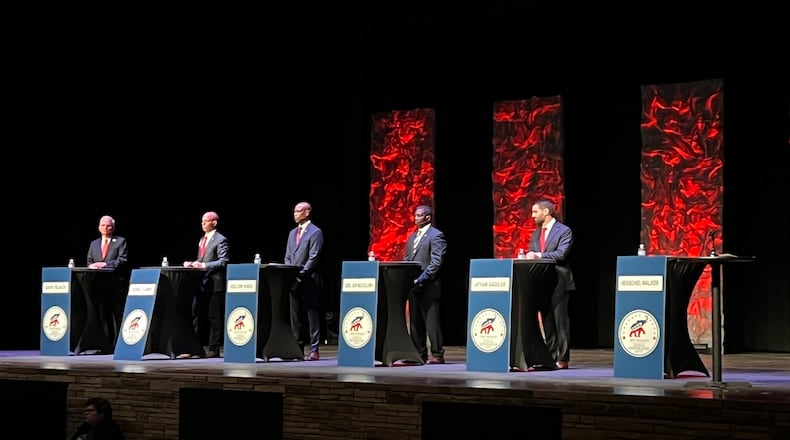 Herschel Walker is represented by an empty podium in this picture of the 9th District GOP Senate debate by Jonathan O’Brien of WDUN.