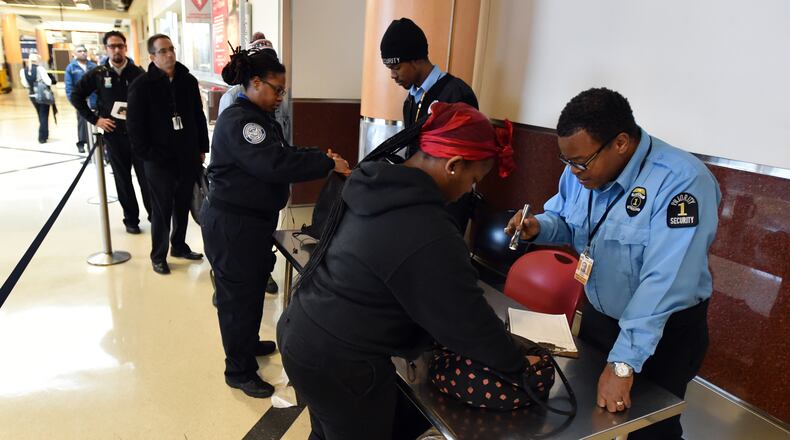 New security measures are being implemented for employees at HartsfieldJackson International Airport. At select entry points security guards are checking employee's personal belongings before they can scan their card and enter their pin code.