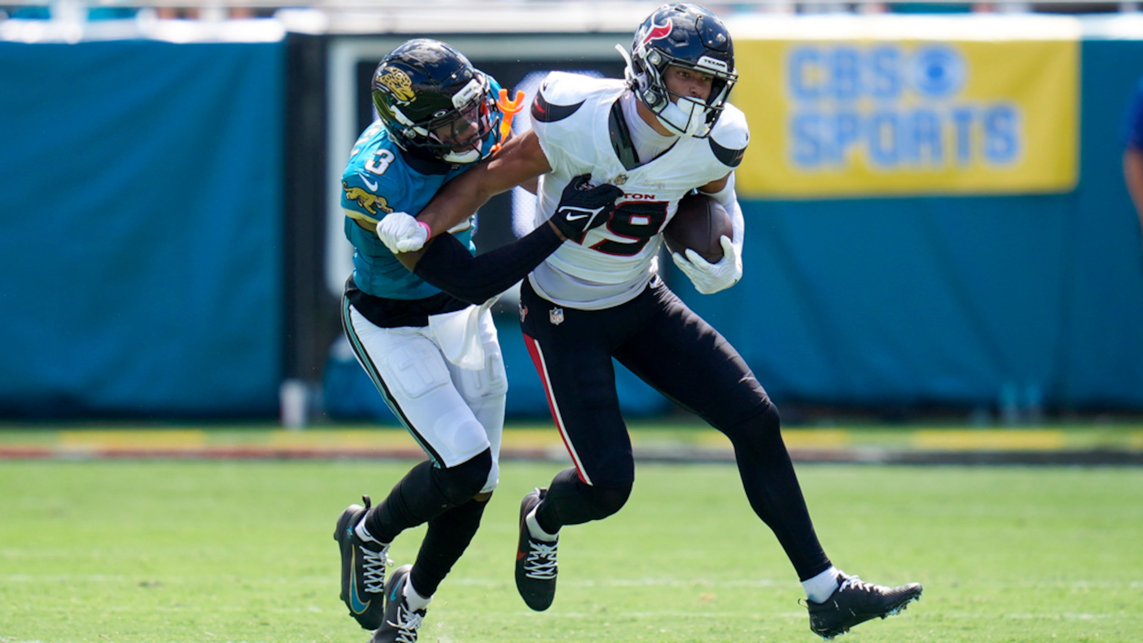 Houston Texans wide receiver Xavier Hutchinson, right, is tackled by Jacksonville Jaguars cornerback Tyson Campbell during the first half of an NFL football game Sunday, Sept. 21, 2025, in Jacksonville, Fla. (John Raoux/AP)