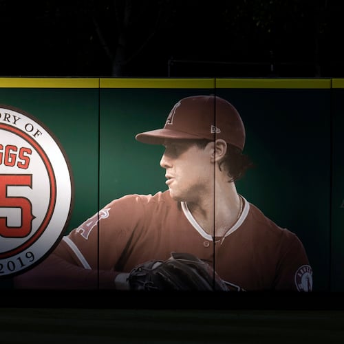 FILE - An image and logo memorializing former Los Angeles Angels pitcher Tyler Skaggs is displayed on the outfield wall in Anaheim, Calif., July 17, 2019. (AP Photo/Kyusung Gong, File)