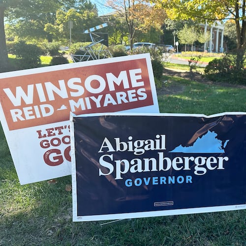 Campaign signs for Virginia gubernatorial nominees Democrat Abigail Spanberger and Republican Winsome Earle-Sears are on display outside City Hall in Fairfax, Va., Friday, Oct. 17, 2025. (AP Photo/Robert Yoon)