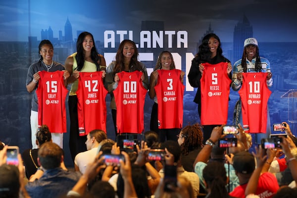 Atlanta Dream players (from left) Allisha Gray, Brionna Jones, Naz Hillmon, Jordin Canada, Angel Reese and Rhyne Howard hold their jersey’s during a press conference to welcome the Atlanta Dream 2026 free agent class. (Jason Getz/AJC)