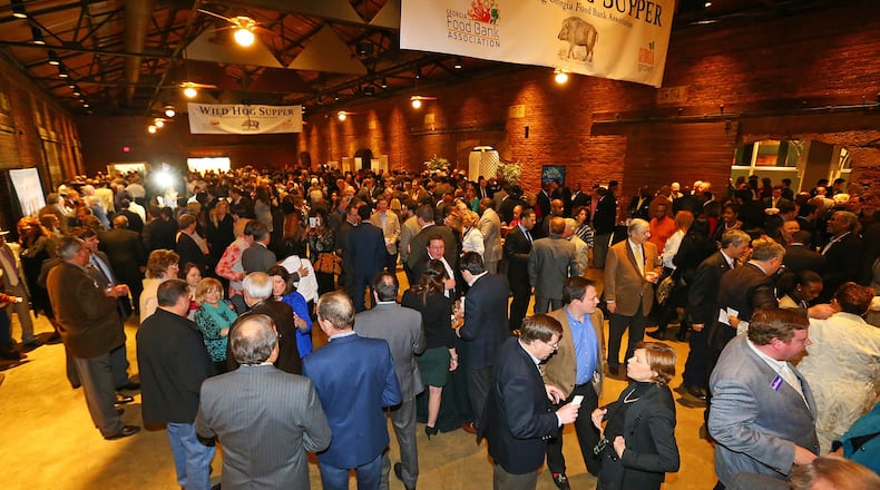 A loophole in Georgia’s ethics laws allows lobbyists to fund such group feeding fests as the annual Wild Hog Supper pictured here. CURTIS COMPTON / CCOMPTON@AJC.COM