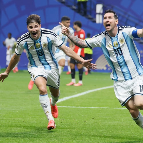 Argentina's Lionel Messi (center) and Julian Alvarez (left) celebrate Messi's game-tying goal while Egypt goalkeeper Mostafa Shobeir kneels on the pitch in the 83rd minute of the Argentina-Egypt FIFA World Cup match at Atlanta Stadium on Tuesday, July 7, 2026. (Miguel Martinez/AJC)