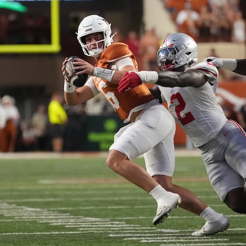 Texas quarterback Arch Manning (16) is sacked for a loss by Ohio State defensive end Kenyatta Jackson Jr. (2) during the first half of an NCAA college football game in Austin, Texas, Saturday, Sept. 12, 2026. (AP Photo/Eric Gay)