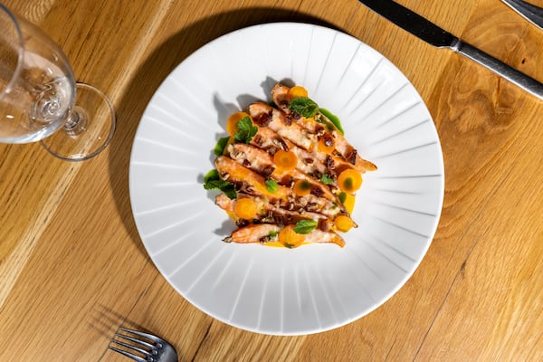 Clem’s carrots, featuring preserved lemon, pickled jalapeño, dates, pecans and mint, is one of the recommended starters at Aria. (Arvin Temkar/AJC)
