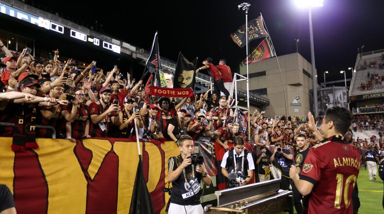 Atlanta United’s Miguel Almiron celebrates with the crowd on Saturday after the team defeated Houston 4-1. (Miguel Martinez / Mundo Hispanico)