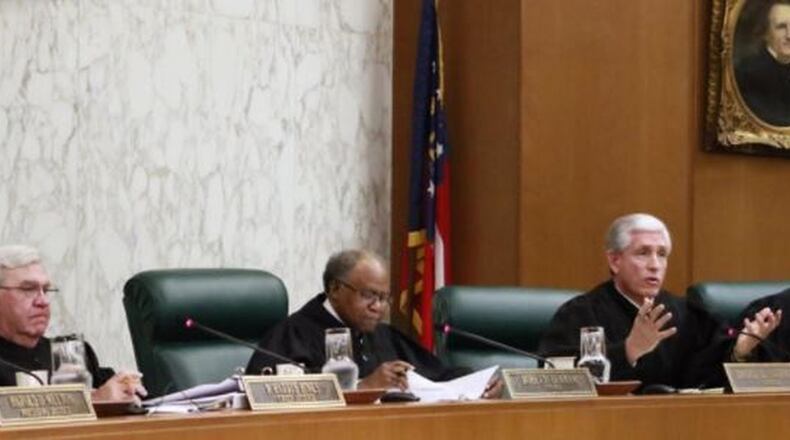 Georgia Supreme Court Justice David Nahmias (second from right), asked whether tax credits are really government money, in a lawsuit involving a $58 million state-authorized program that subsidizes private schools, many of them religious. Plaintiffs argue that’s a violation of the separation of church and state mandate in the state constitution. BOB ANDRES /BANDRES@AJC.COM