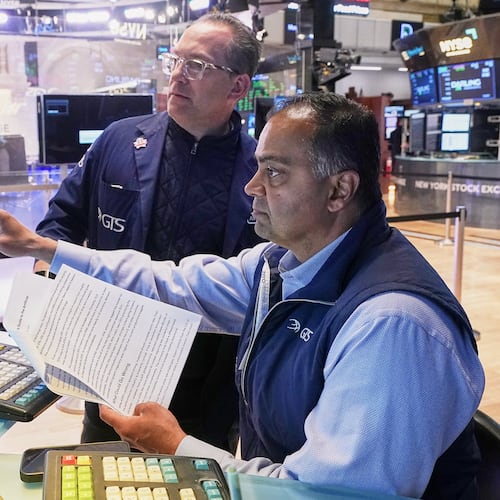 Specialists Anthony Matesic, left, and Dilip Patel work on the floor of the New York Stock Exchange, Monday, May 11, 2026. (AP Photo/Richard Drew)
