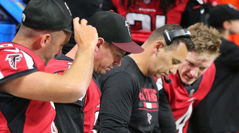August 31, 2017 Atlanta: Falcons quarterbacks Matt Schaub (from left), Matt Ryan and Matt Simms confer with offensive coordinator Steve Sarkisian on the sidelines during the second quarter against the Jaguars in a NFL preseason football game on Thursday, August 31, 2017, in Atlanta. Curtis Compton/ccompton@ajc.com