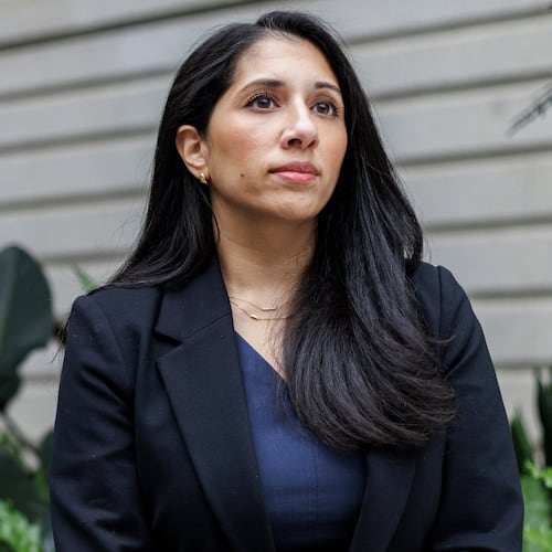 Anam Petit, a former Justice Department employee, poses for a portrait in the Robert and Arlene Kogod Courtyard at the National Portrait Gallery in Washington, Friday, Jan. 9, 2026. (AP Photo/Moriah Ratner)