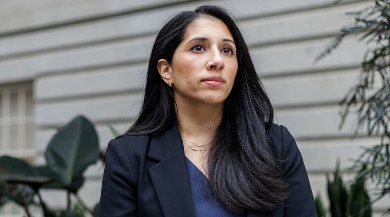 Anam Petit, a former Justice Department employee, poses for a portrait in the Robert and Arlene Kogod Courtyard at the National Portrait Gallery in Washington, Friday, Jan. 9, 2026. (AP Photo/Moriah Ratner)