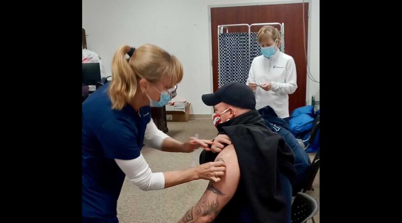 Savannah Fire Department Capt. Kevan Carter receives a COVID-19 vaccination shot on Monday, Dec. 21, 2020. He was one of 34 department workers to get vaccinated. PHOTO CREDIT: Savannah Fire Department.
