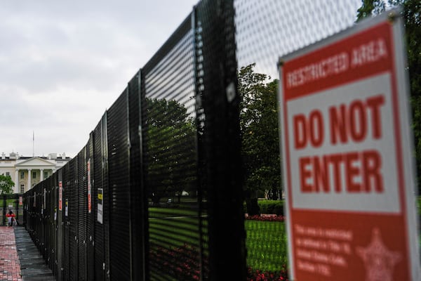 A fence blocks access to the White House ahead of an upcoming military parade commemorating the U.S. Army's 250th anniversary and coinciding with President Donald Trump's 79th birthday, Saturday, June 14, 2025, in Washington (AP Photo/Julia Demaree Nikhinson)