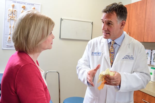 Dr. David Prologo, Emory division director for interventional radiology, consults with a patient. Interventional radiologists are special doctors who use technology, like robotics, to perform minimally invasive treatments. (Courtesy of Winship Cancer Institute of Emory University)
