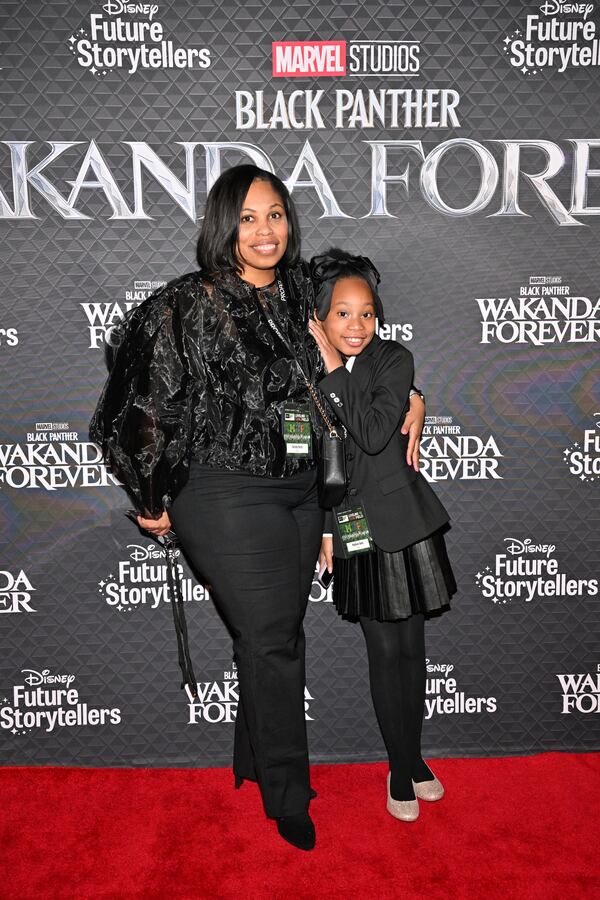 ATLANTA, GEORGIA - NOVEMBER 09: Cortney Harris and Madison Davis attend the Black Panther: Wakanda Forever Atlanta Red Carpet Community Screening at The Plaza Theater on November 09, 2022 in Atlanta, Georgia. (Photo by Derek White/Getty Images for Disney)